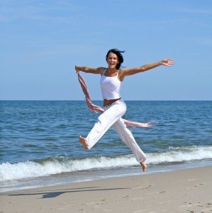 Jumping Woman On Beach